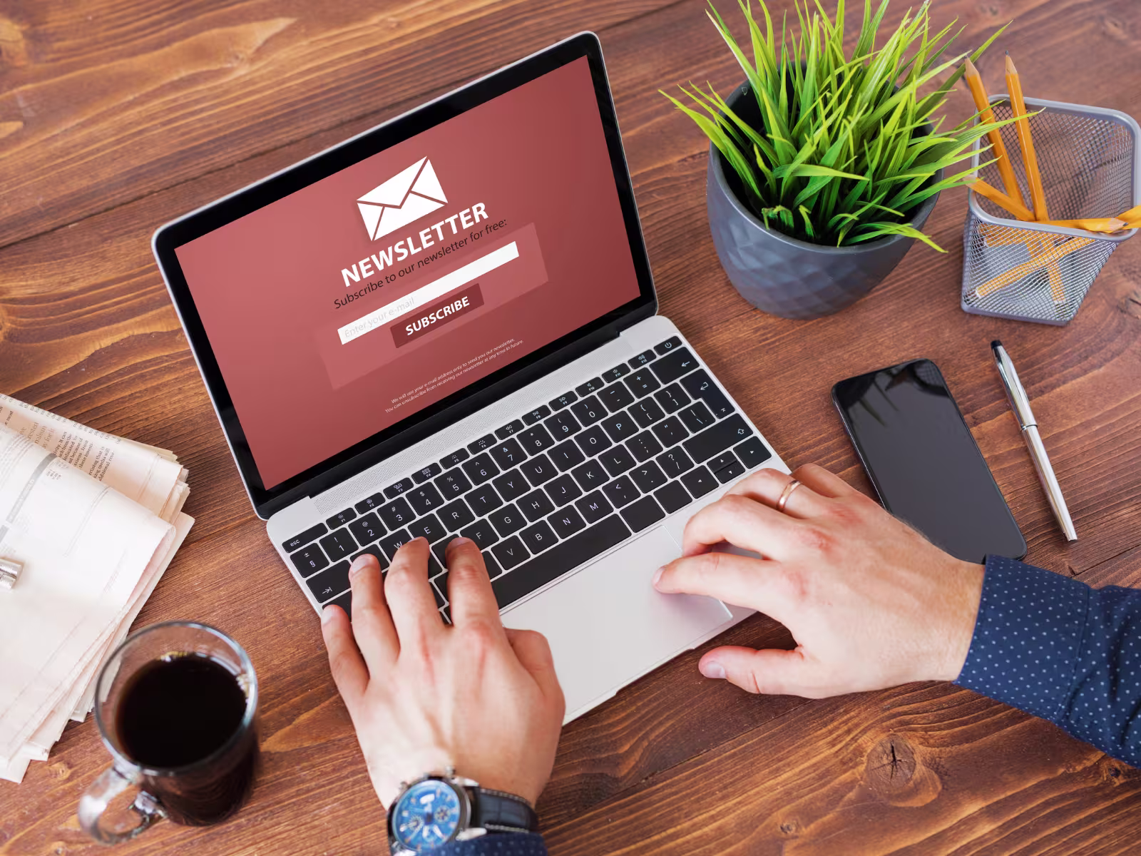 Person working on an email newsletter campaign on a laptop