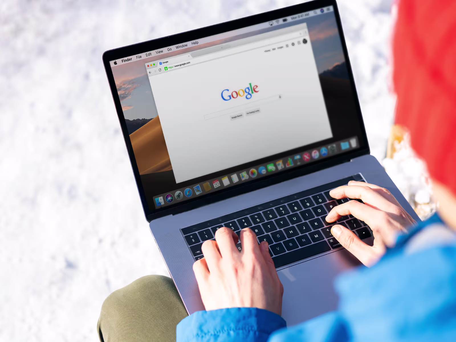 Person using Google search on a laptop