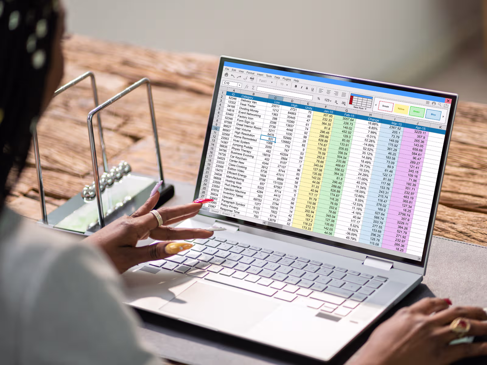 Business professional managing information manually in a large spreadsheet