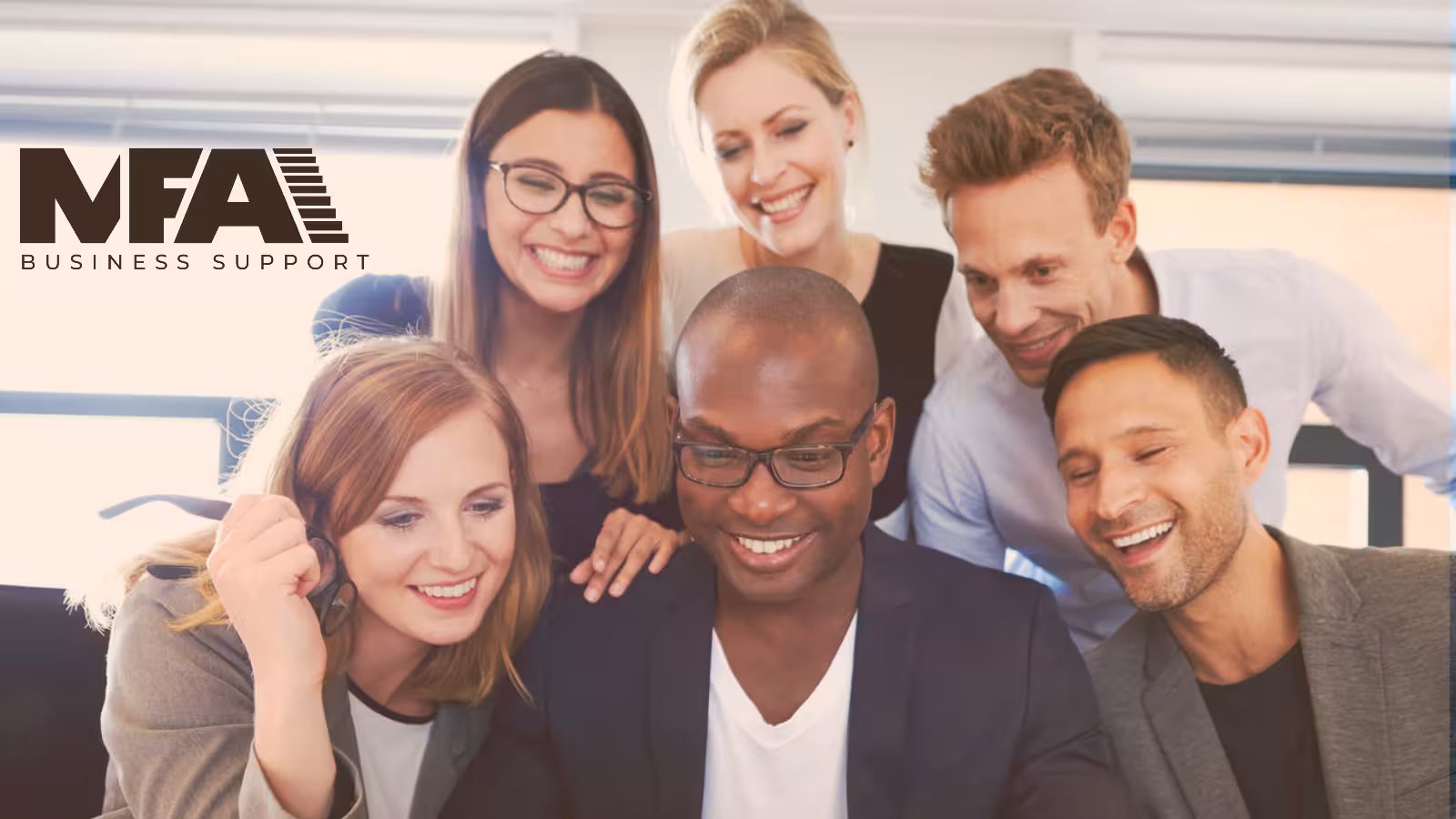Six professionals gathered together looking at a screen, with the MFA Business Support logo.