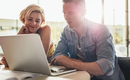 image of couple watching video on computer