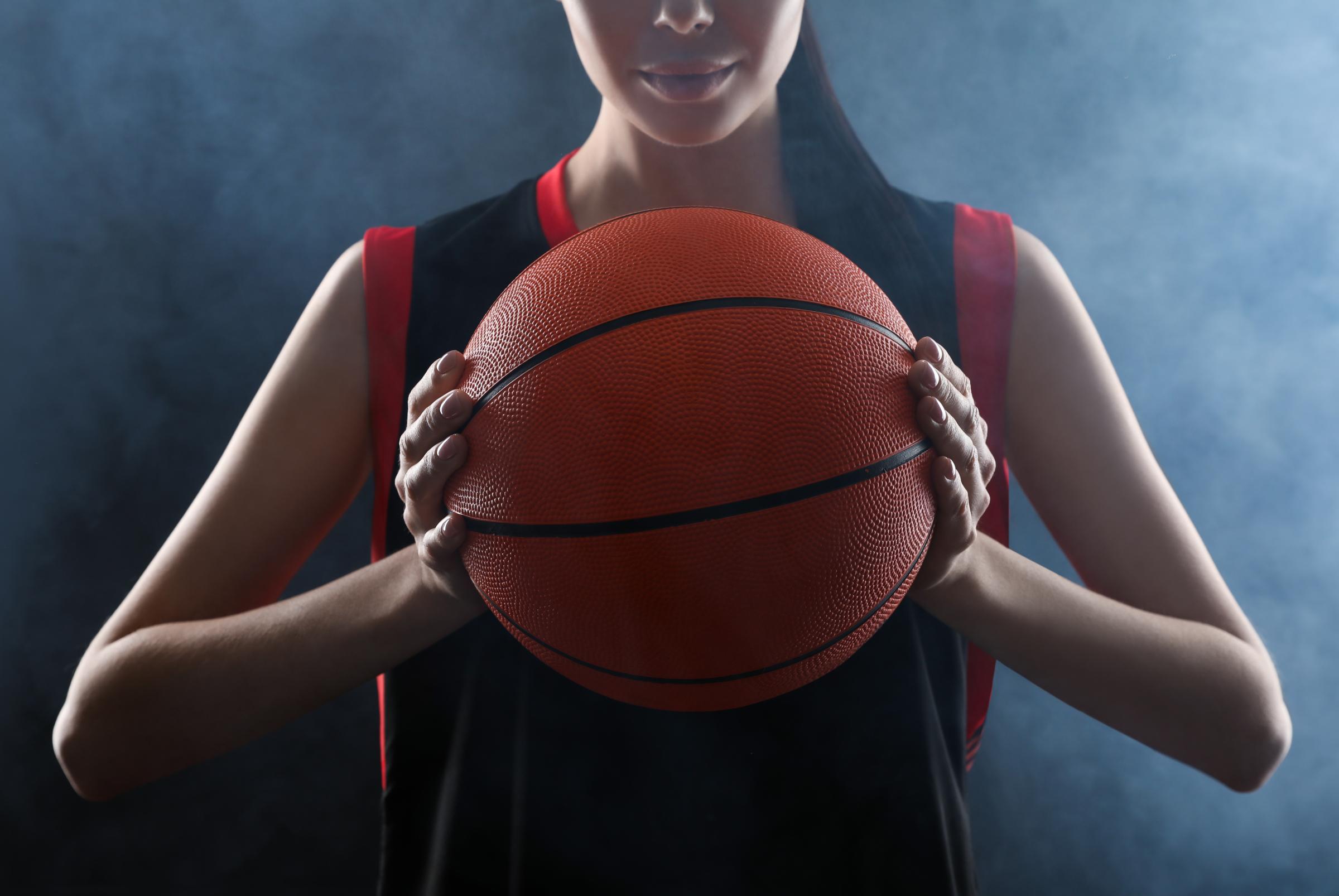 Girl holding basketball