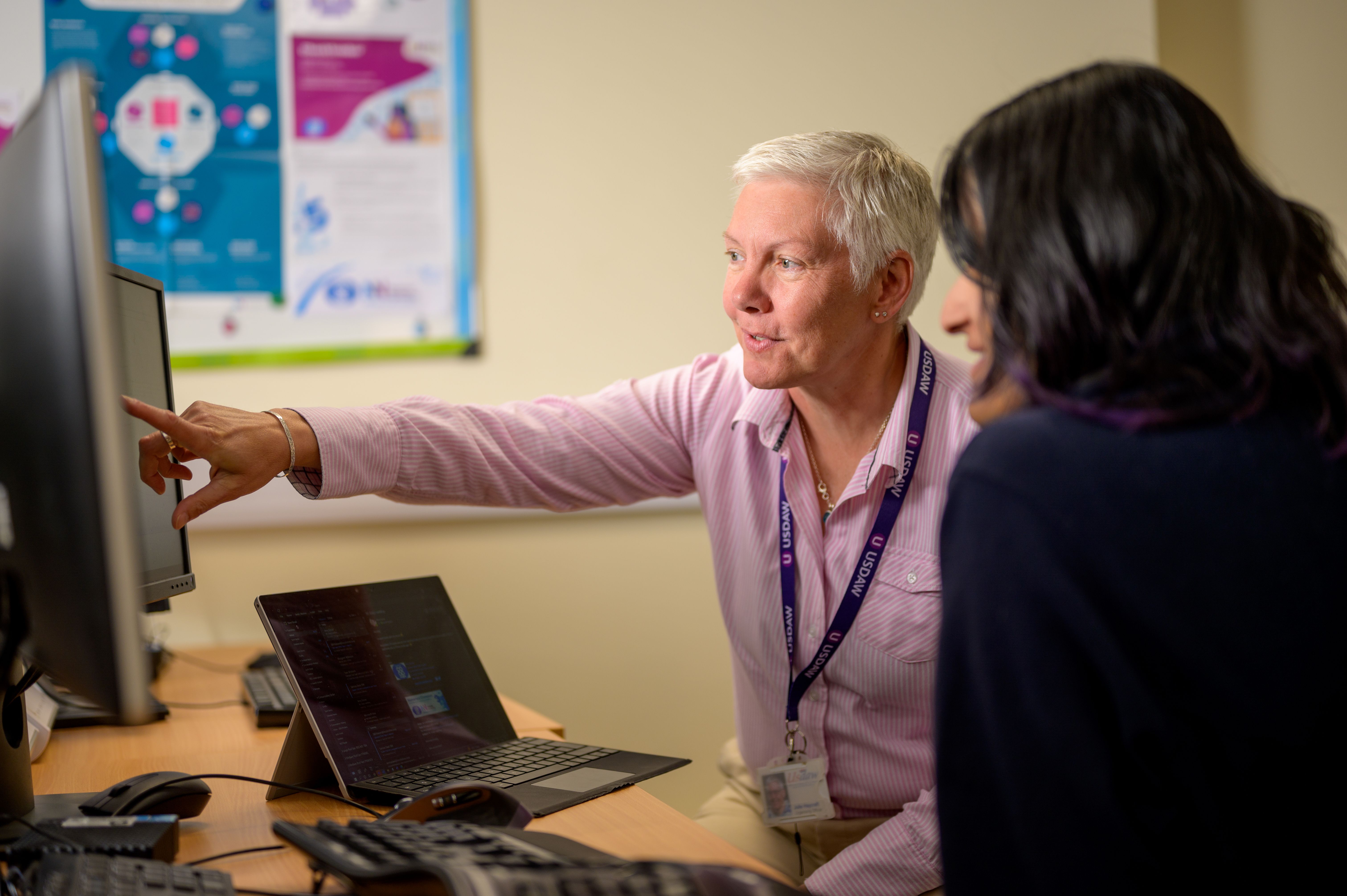 Higher ed IT staff reviewing HECVAT vendor security requirements on a desktop