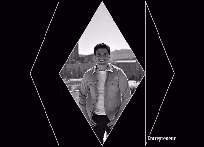 An illustration of a group of developers smiling with city on their back