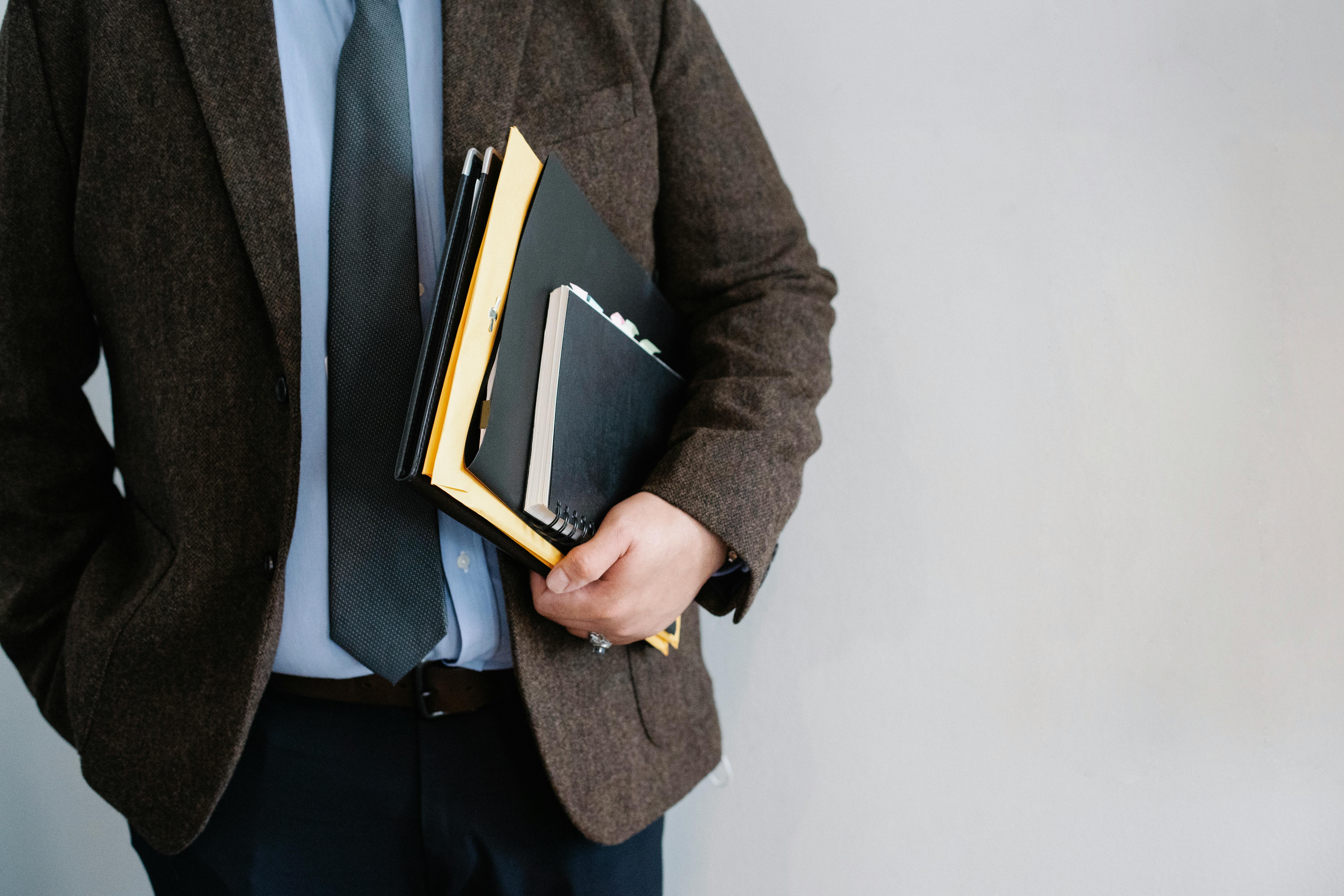A businessman holding a folder