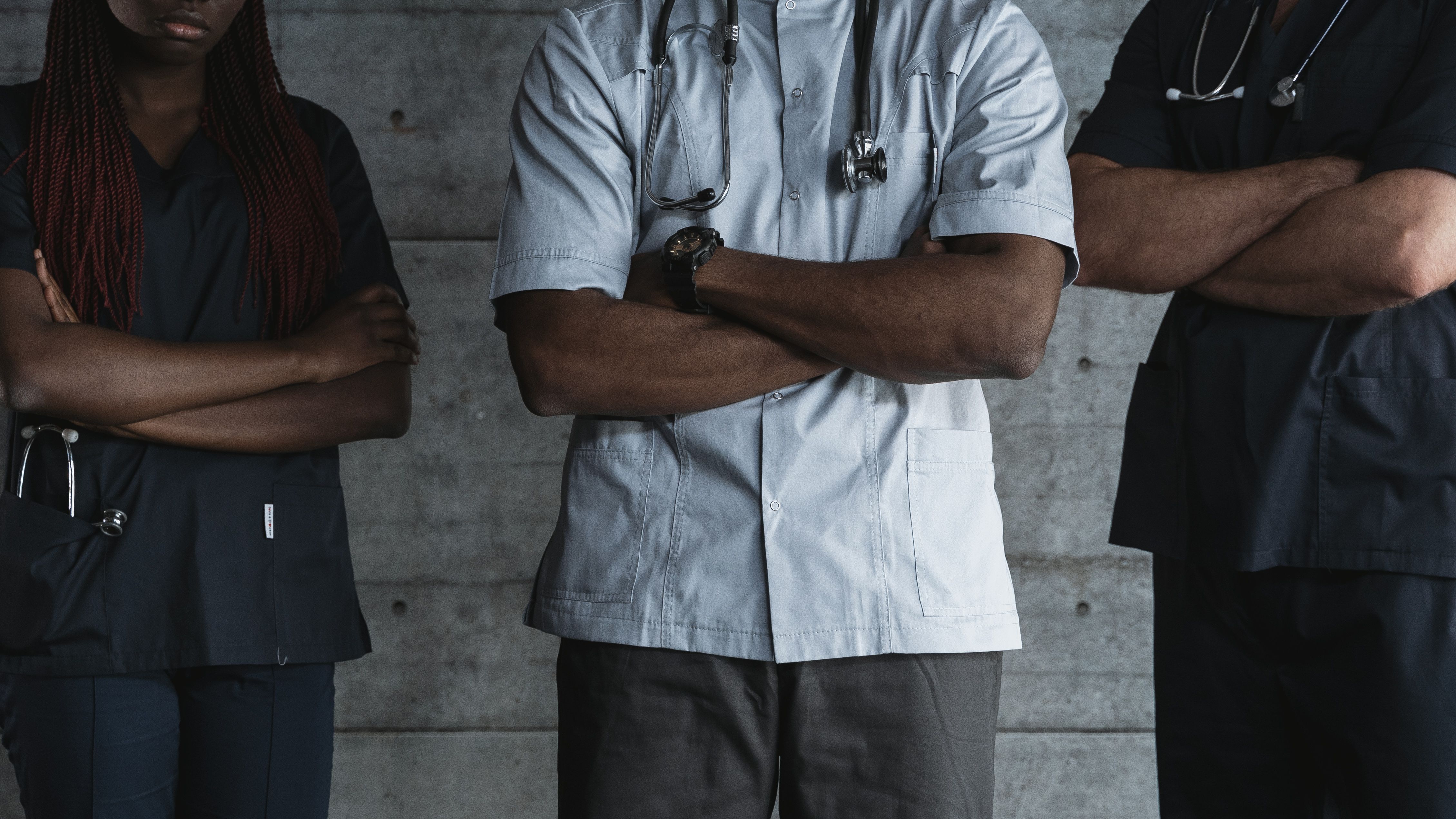 A photo of doctors and nurses in their work uniforms