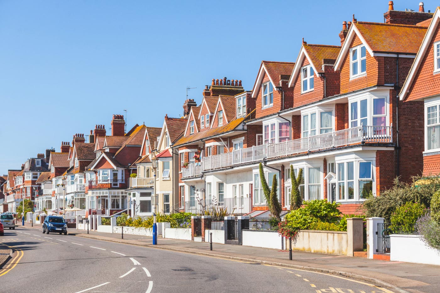 A row of English terraced houses on a residential street, representing a home a borrower is moving to