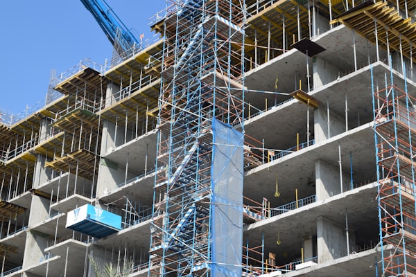 A building under construction with blue accents