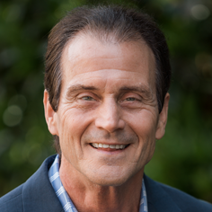 Headshot of John Muhich, Founder and Managing Director of AAA Storage Investments