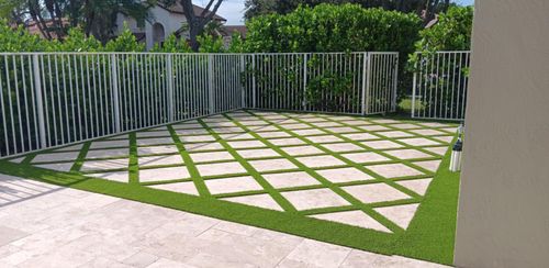 patio with pavers and artificial turf