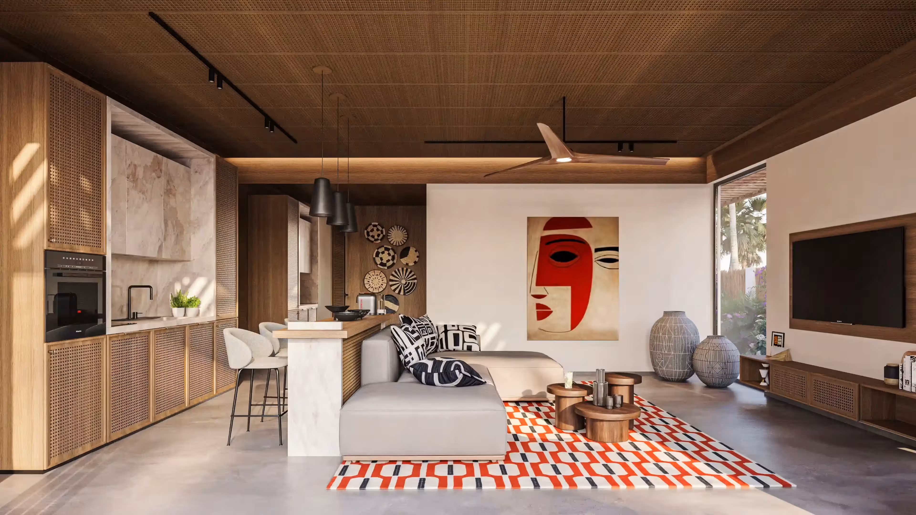 Modern living room with wooden ceiling, abstract face art, gray sofa, patterned rug, and kitchen area.