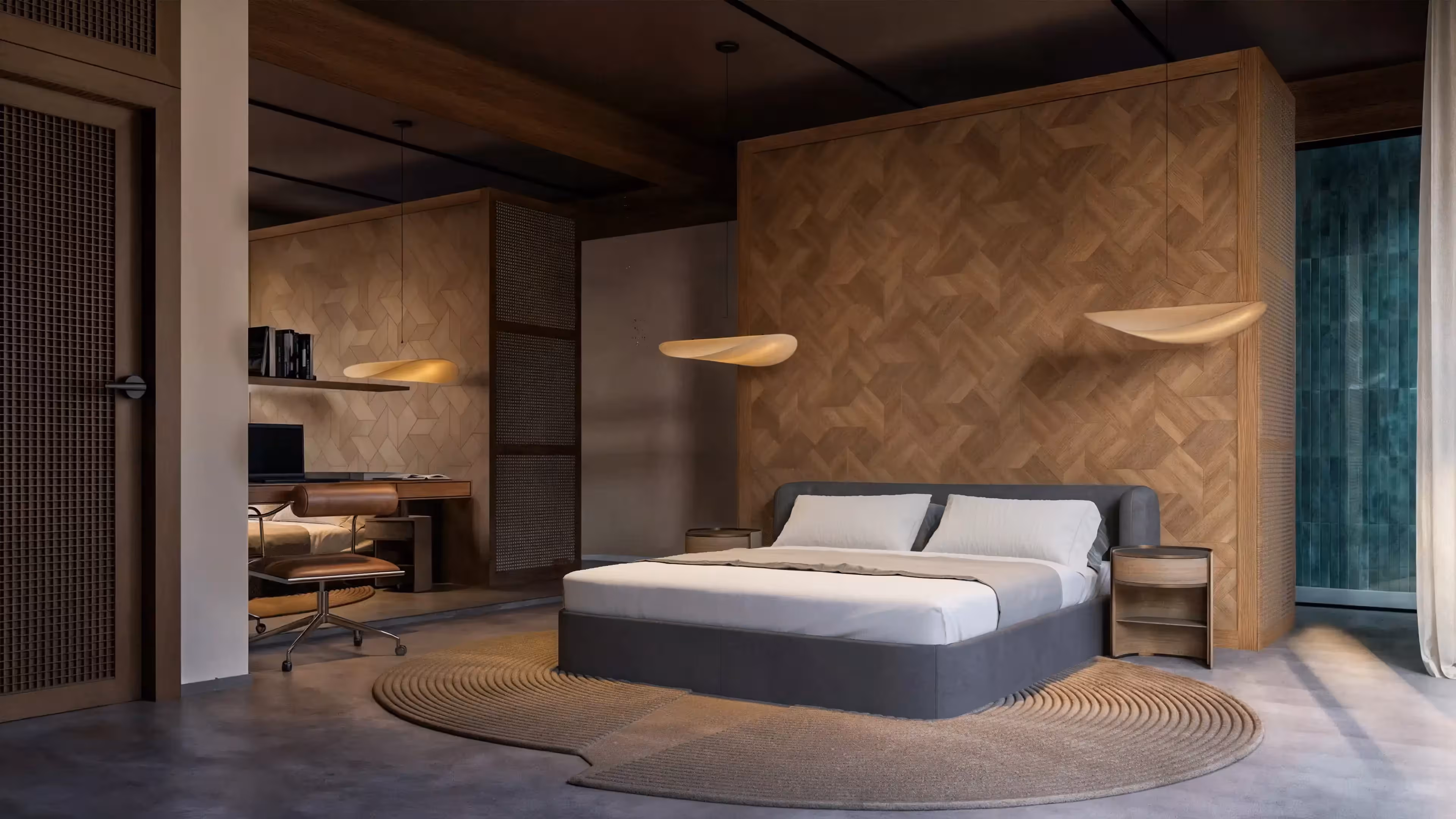 Modern bedroom with gray bed, round beige rug, wooden accent wall, and hanging pendant lights.