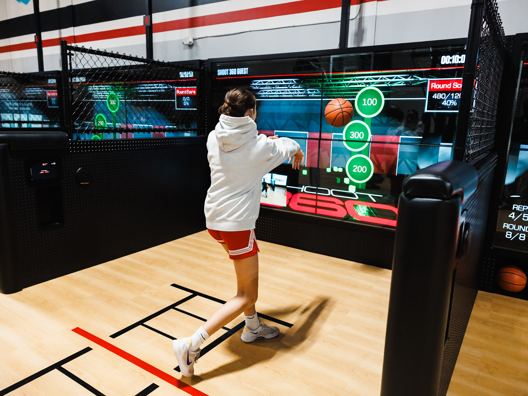 Player practicing basketball shots using advanced shooting station at Shoot 360 San Mateo.
