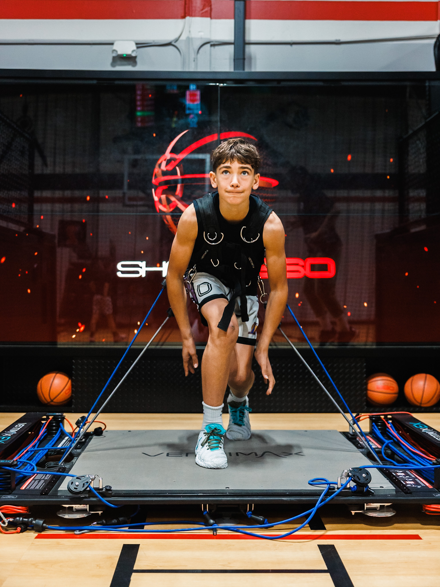 Player reviewing real-time analytics on the Shoot 360 app to track basketball training progress.