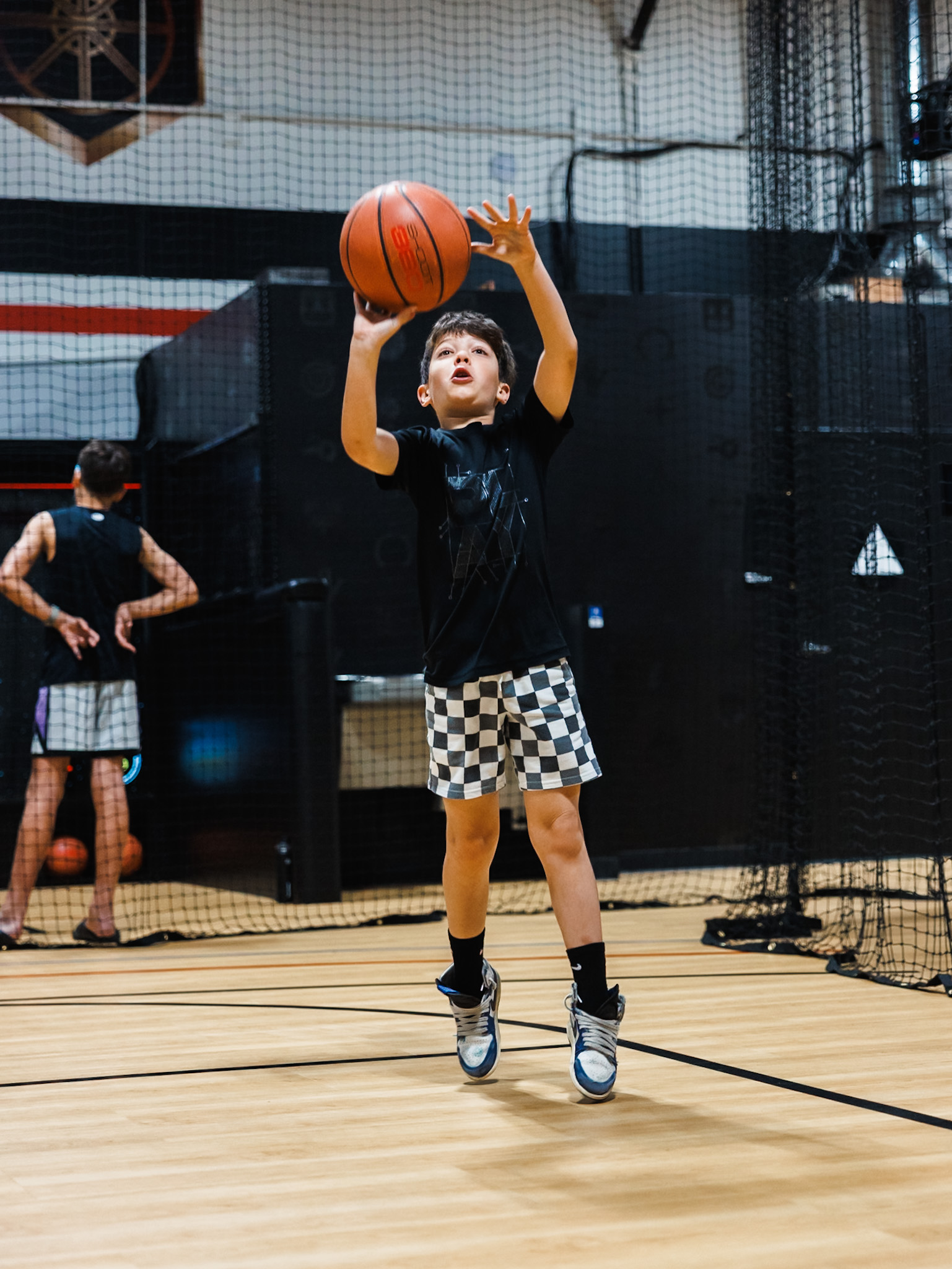Basketball coach guiding birthday party guests through exciting basketball drills and games at Shoot 360 San Mateo.