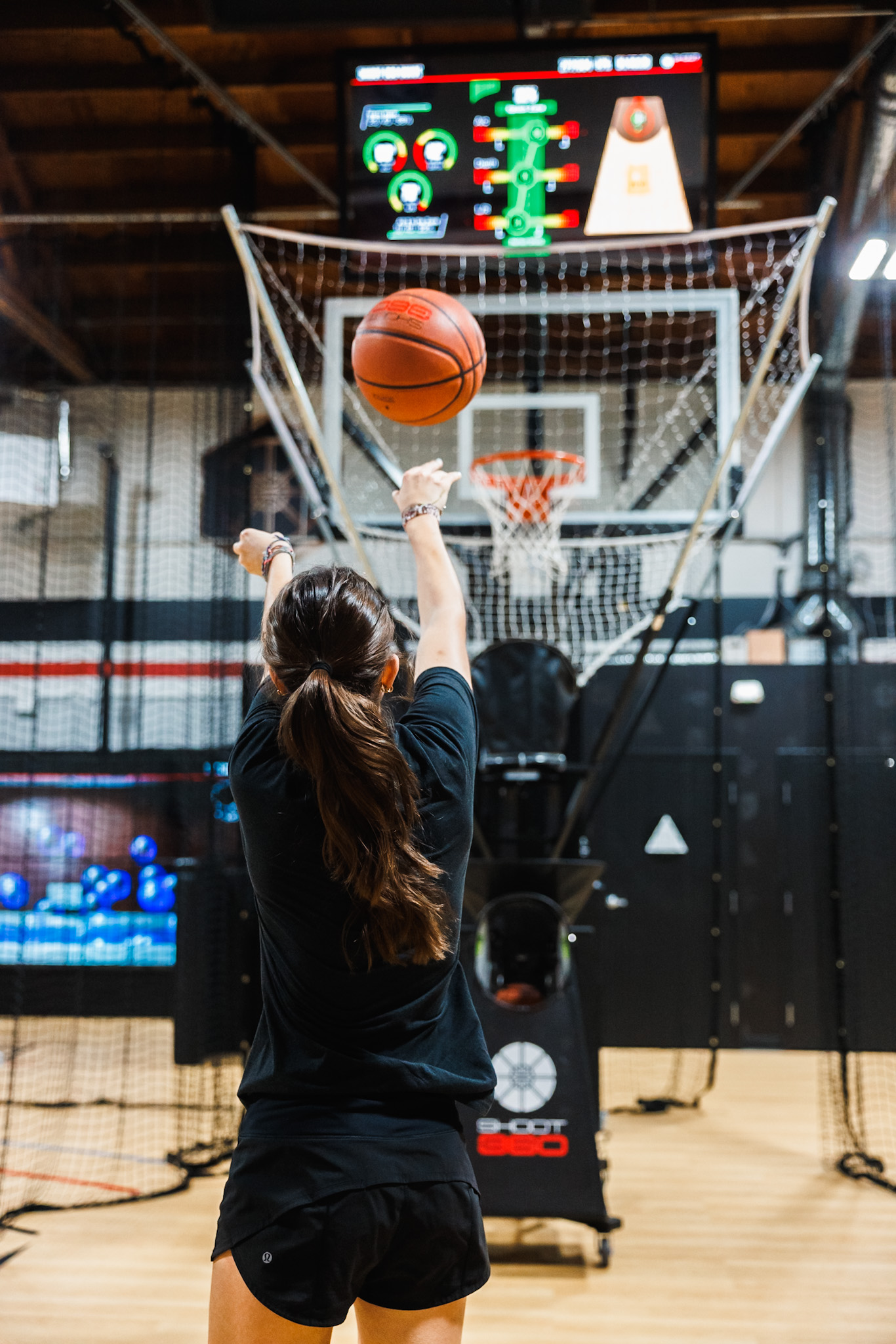 New trial participant experiencing a personalized basketball training session at Shoot 360 San Mateo with interactive coaching tools.