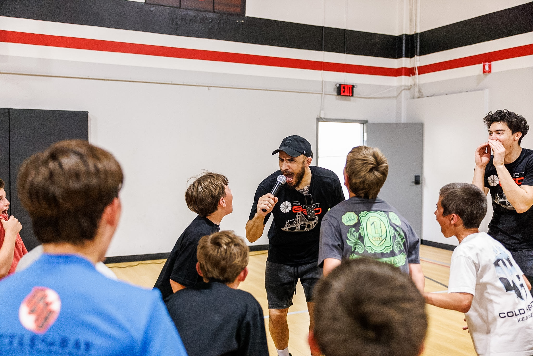 Basketball coach guiding birthday party guests through exciting basketball drills and games at Shoot 360 San Mateo.