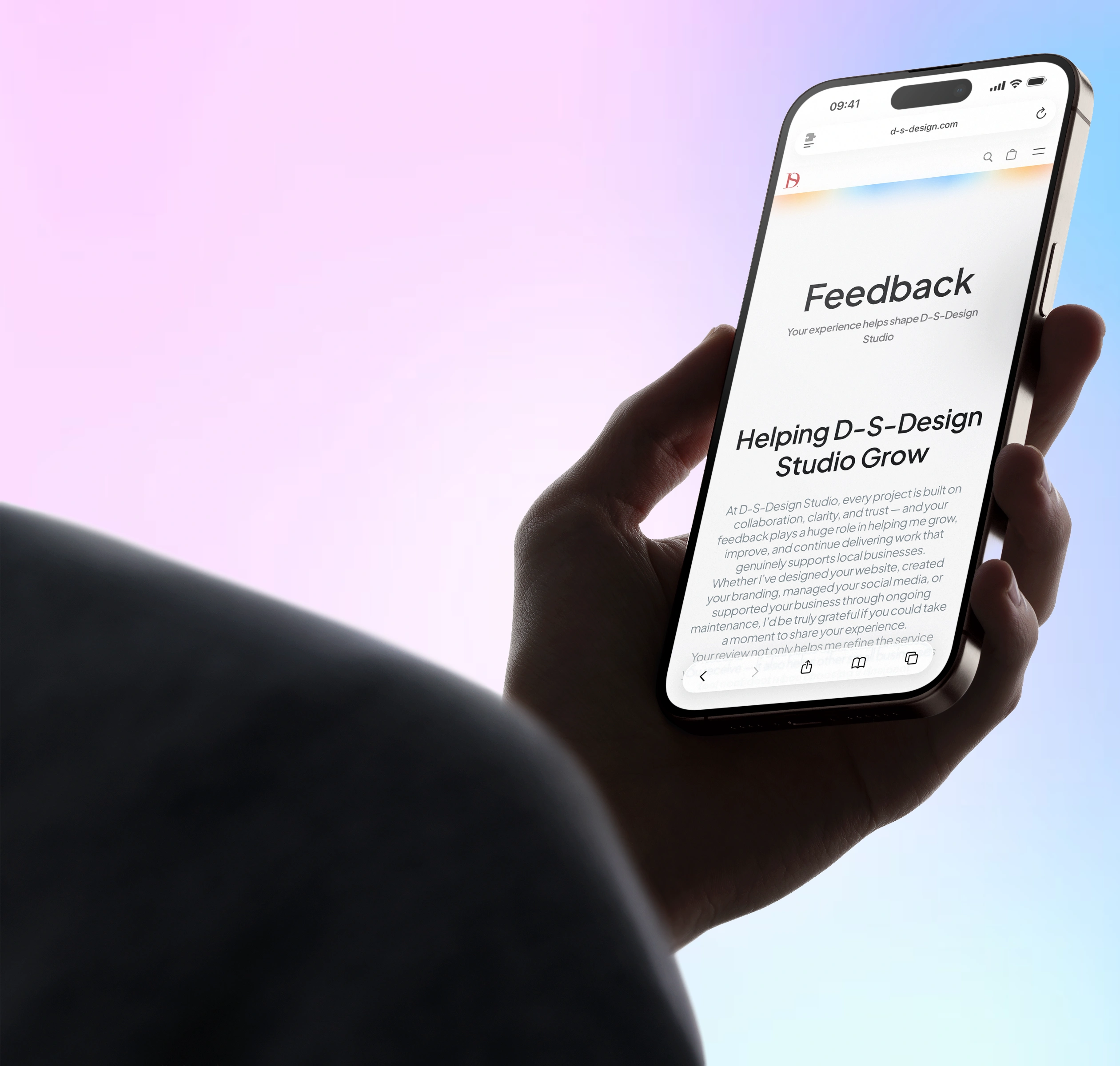 Person holding a smartphone displaying a feedback page for D-S-Design Studio with text about helping the studio grow.