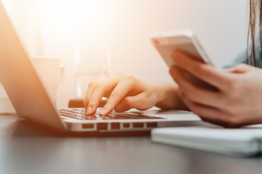 A clean modern website interface showing a trust badge, testimonials, and contact details.