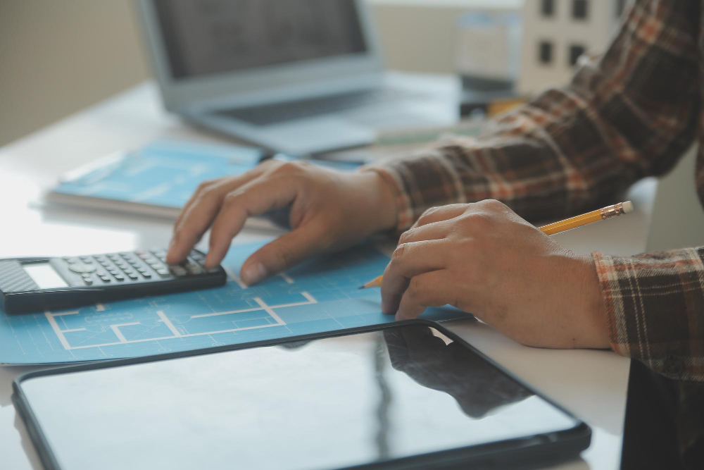 Designer reviewing website pricing and planning costs for a small business website.