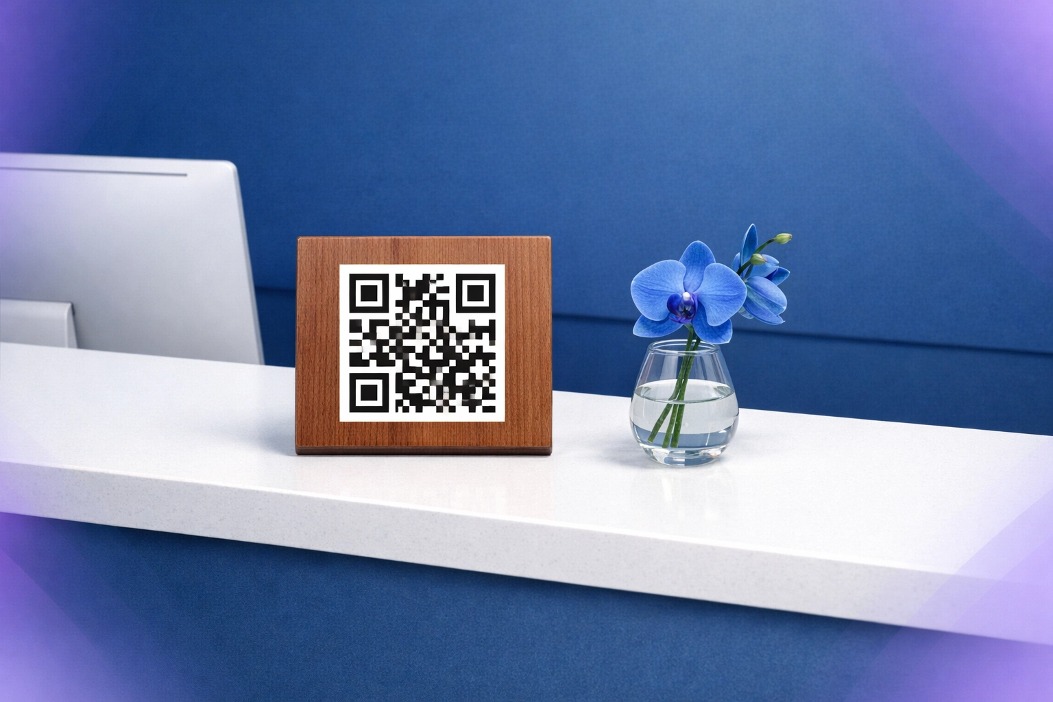 Clean medical reception desk featuring a minimalist QR code sign instead of bulky tablet charging stations.