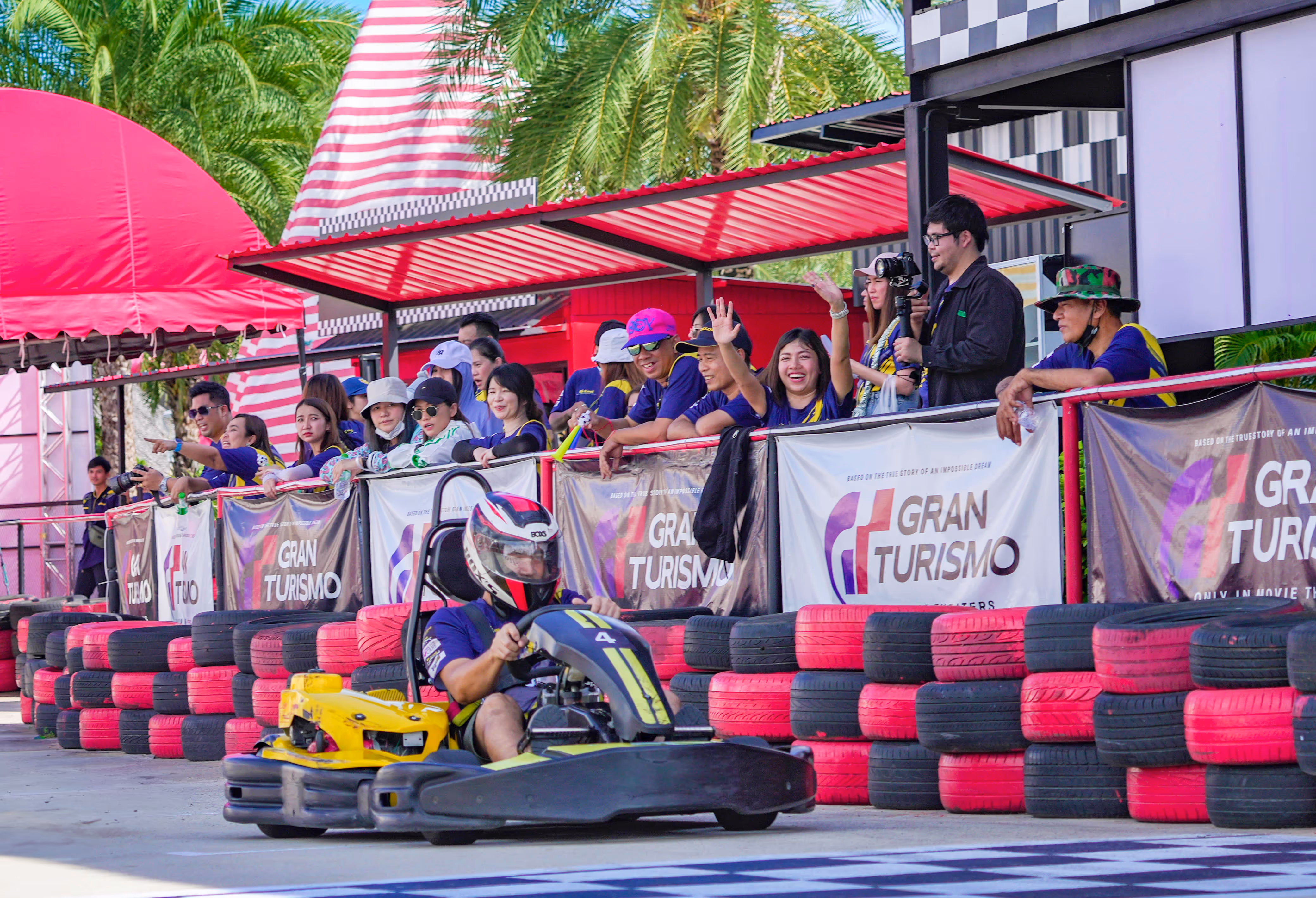 A person driving gokart at gran turismo zone at columbia pictures aquaverse