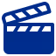 Blue movie clapperboard icon on a dark gray background, with diagonal stripes on the top clapper and horizontal stripes on the bottom half.

