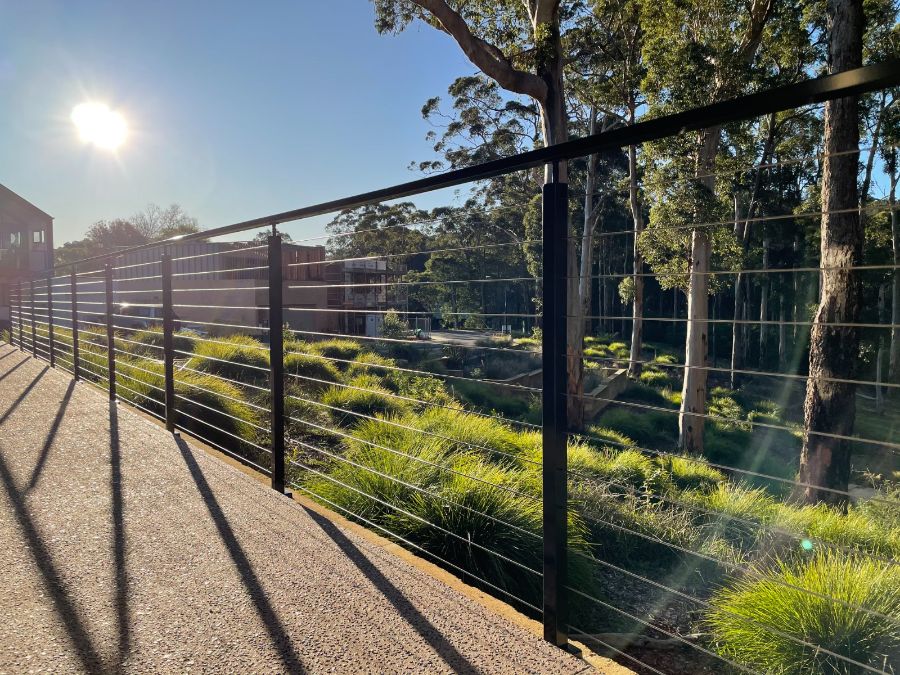 Finished stainless wire balustrade along a deck