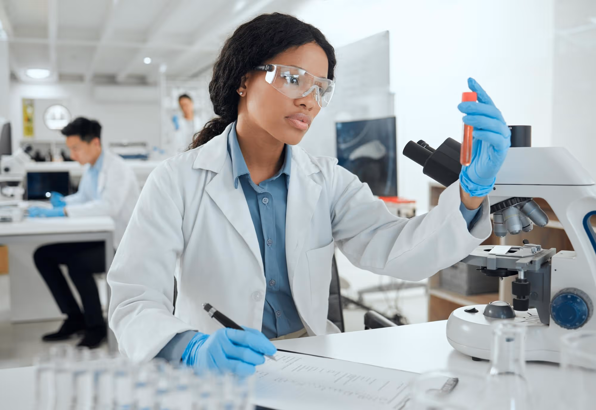 A student in safety glasses working in a training lab