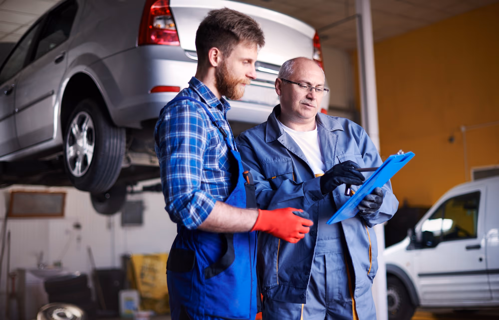 Two technicians reviewing work together