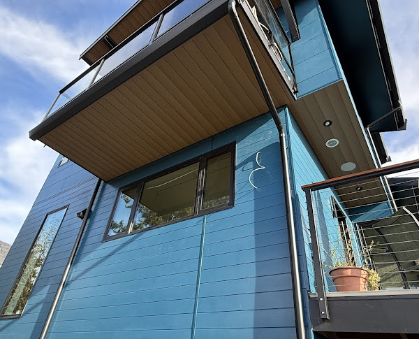 Construction photo showing installation of a ventilated rainscreen system behind Nichiha panels for moisture control in Seattle’s damp climate.