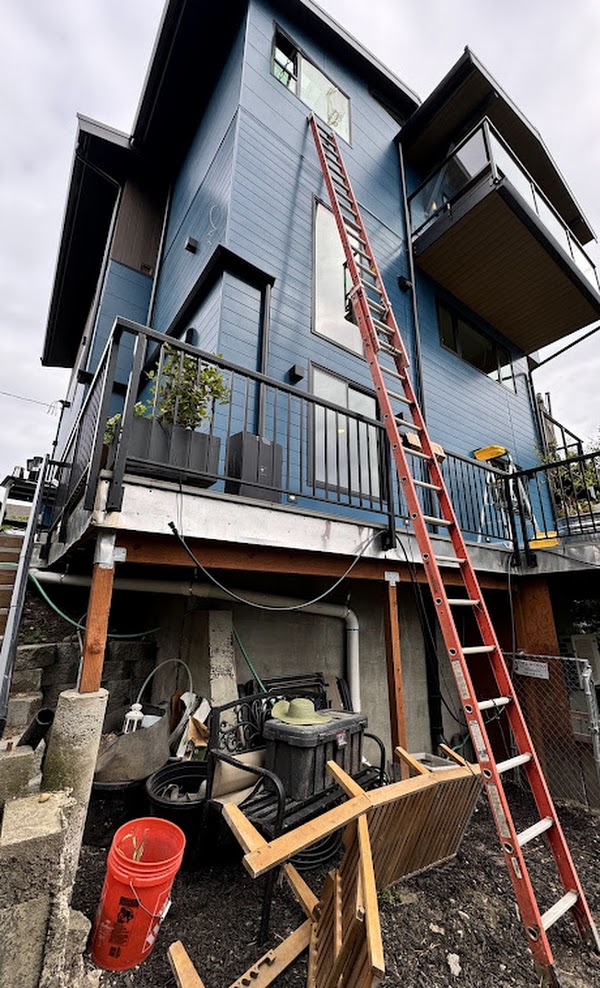 Exterior walls of the house prepared with furring strips for a ventilated rainscreen system before Nichiha siding is applied.