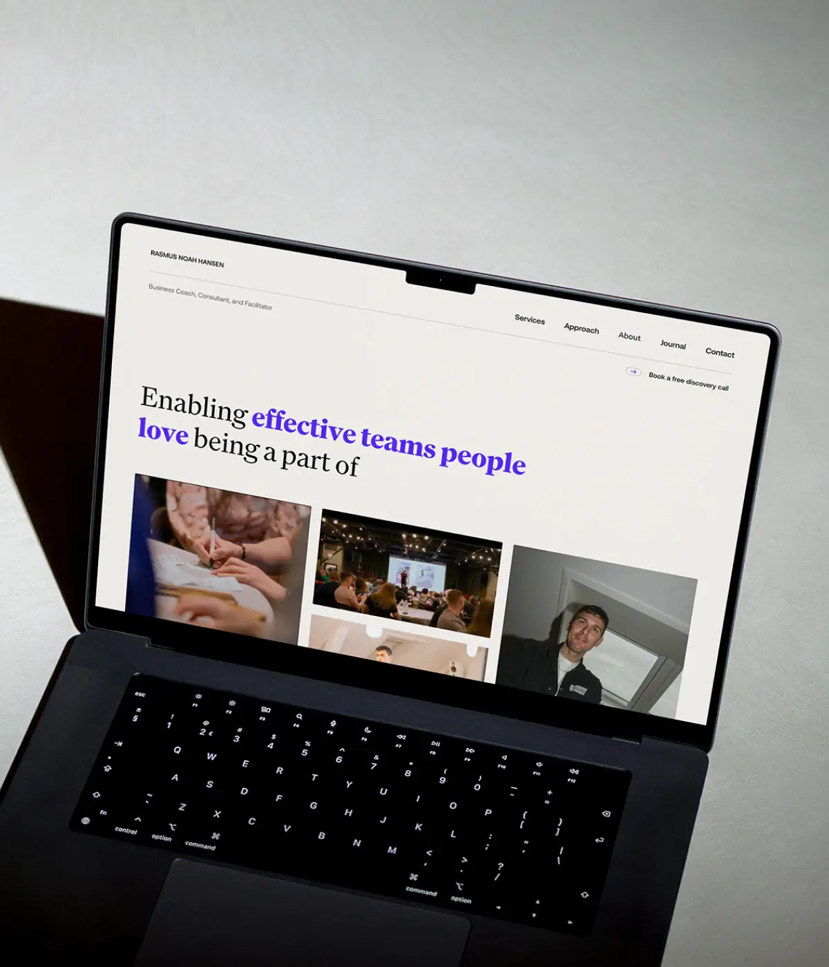 Rasmus Noah Hansen homepage displayed on a MacBook with minimal typography, reflecting restrained digital design, editorial clarity, and refined visual direction.