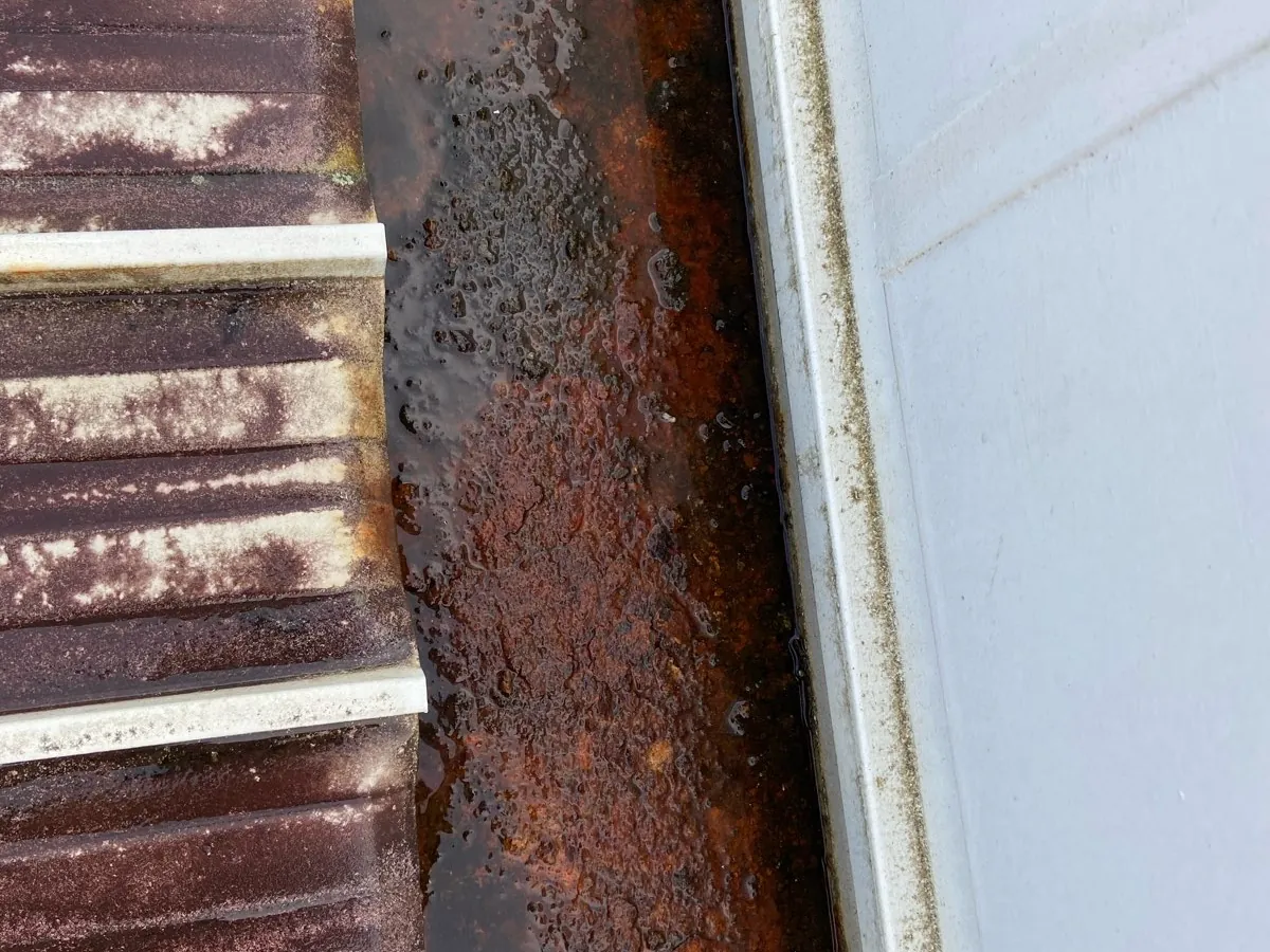 Corroded internal gutter on the original Glenfield roof