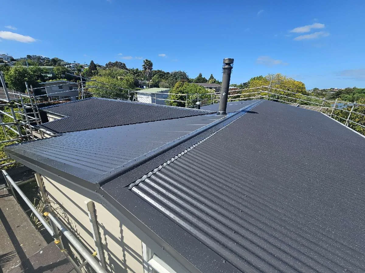 Ridge capping running up to the flue on the Hillcrest reroof