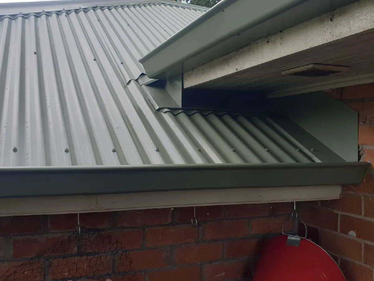 New Mist Green spouting and apron flashing on the Morningside reroof