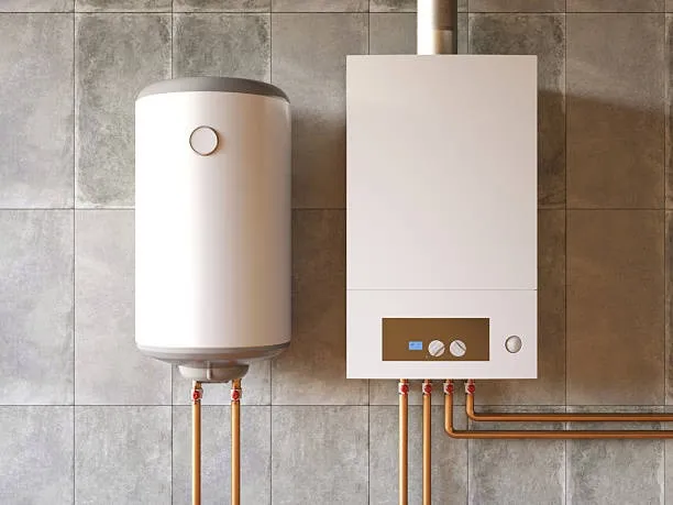 White cylindrical water heater and rectangular boiler mounted on a tiled wall with copper pipes connected underneath.