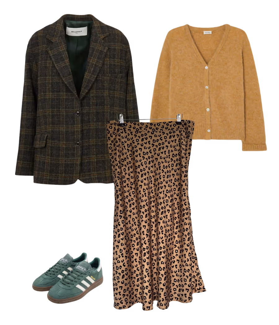 Leopard skirt styled with plaid blazer and green sneakers for a playful autumn mix of prints and textures.