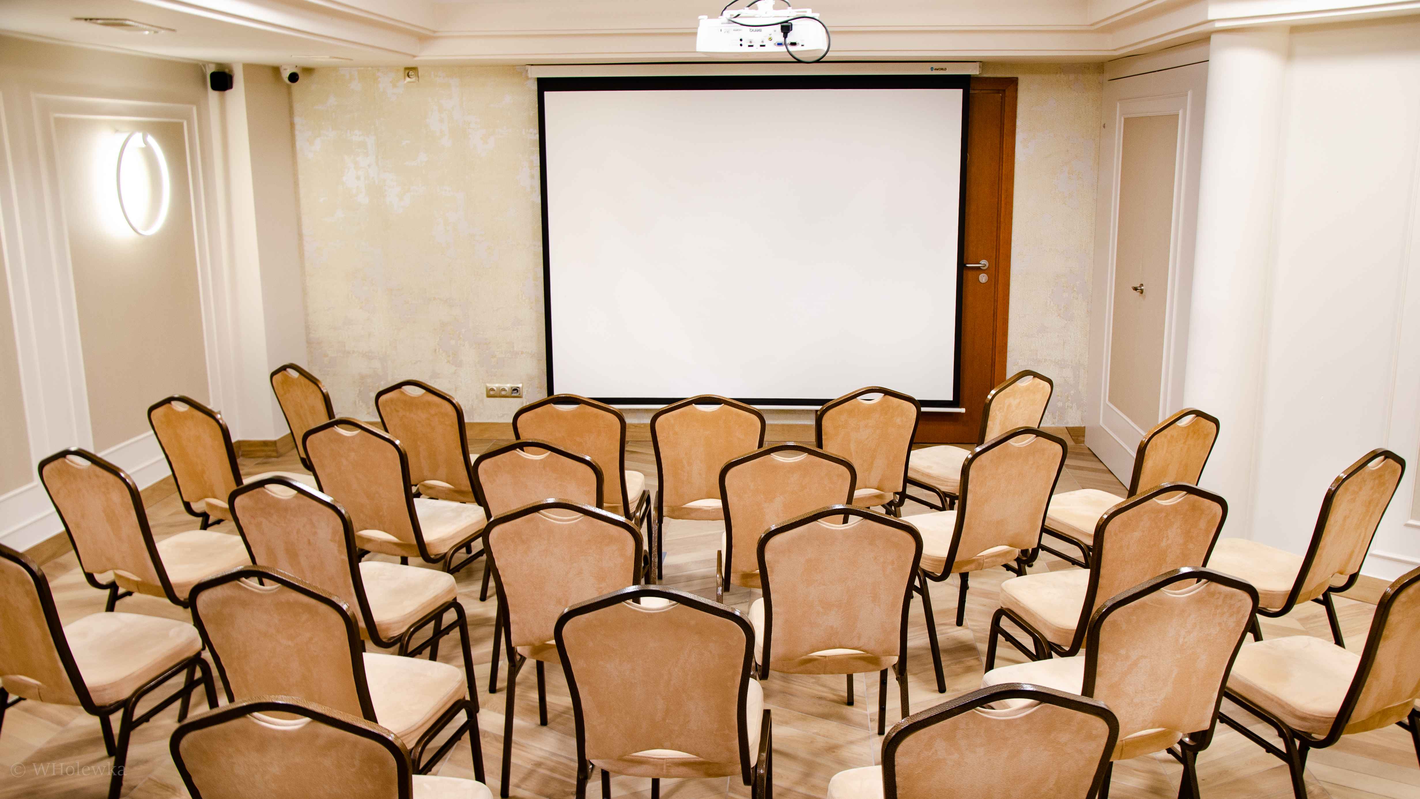 Business space with chairs in a front of tv
