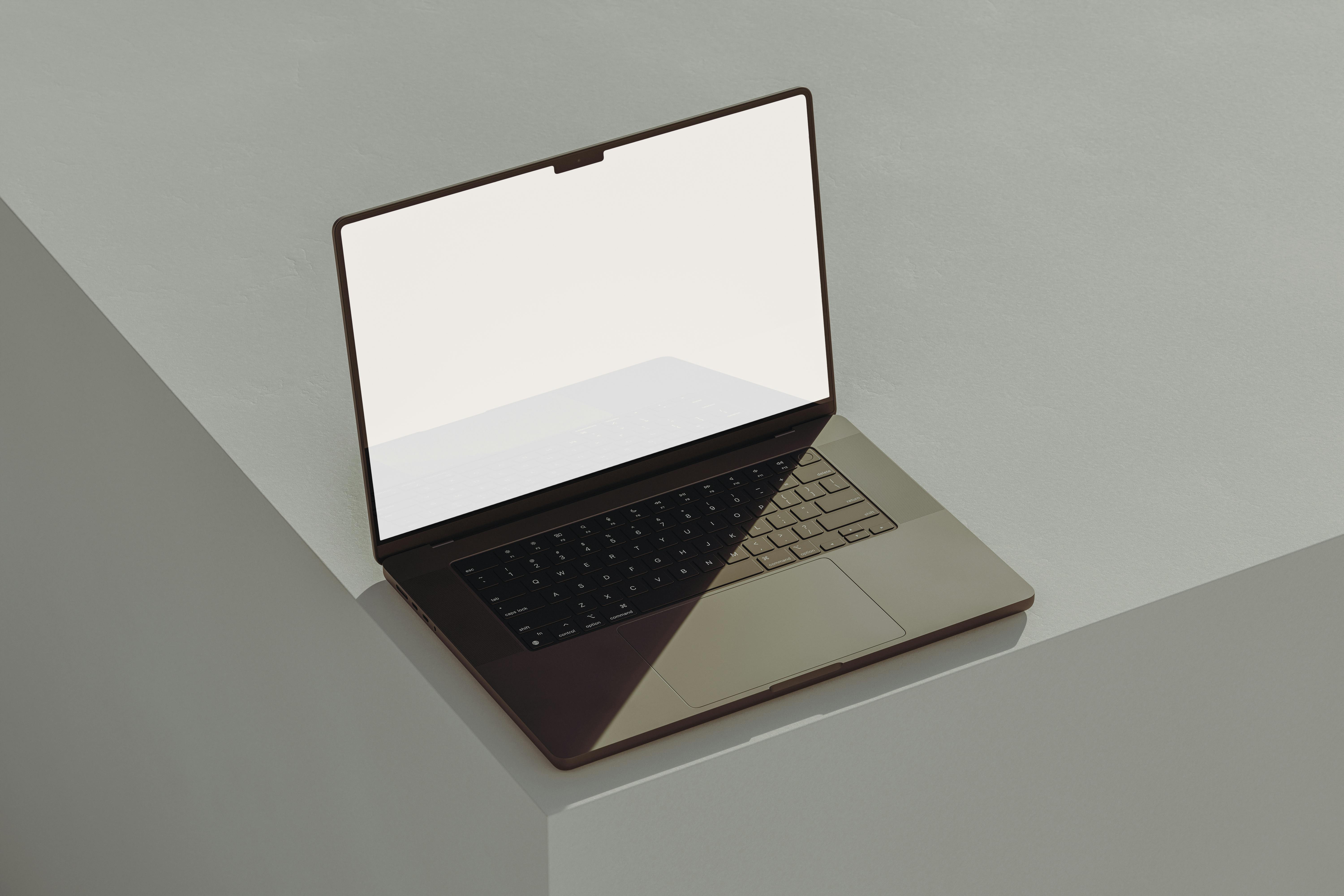 A gaming laptop on the edge of a desk