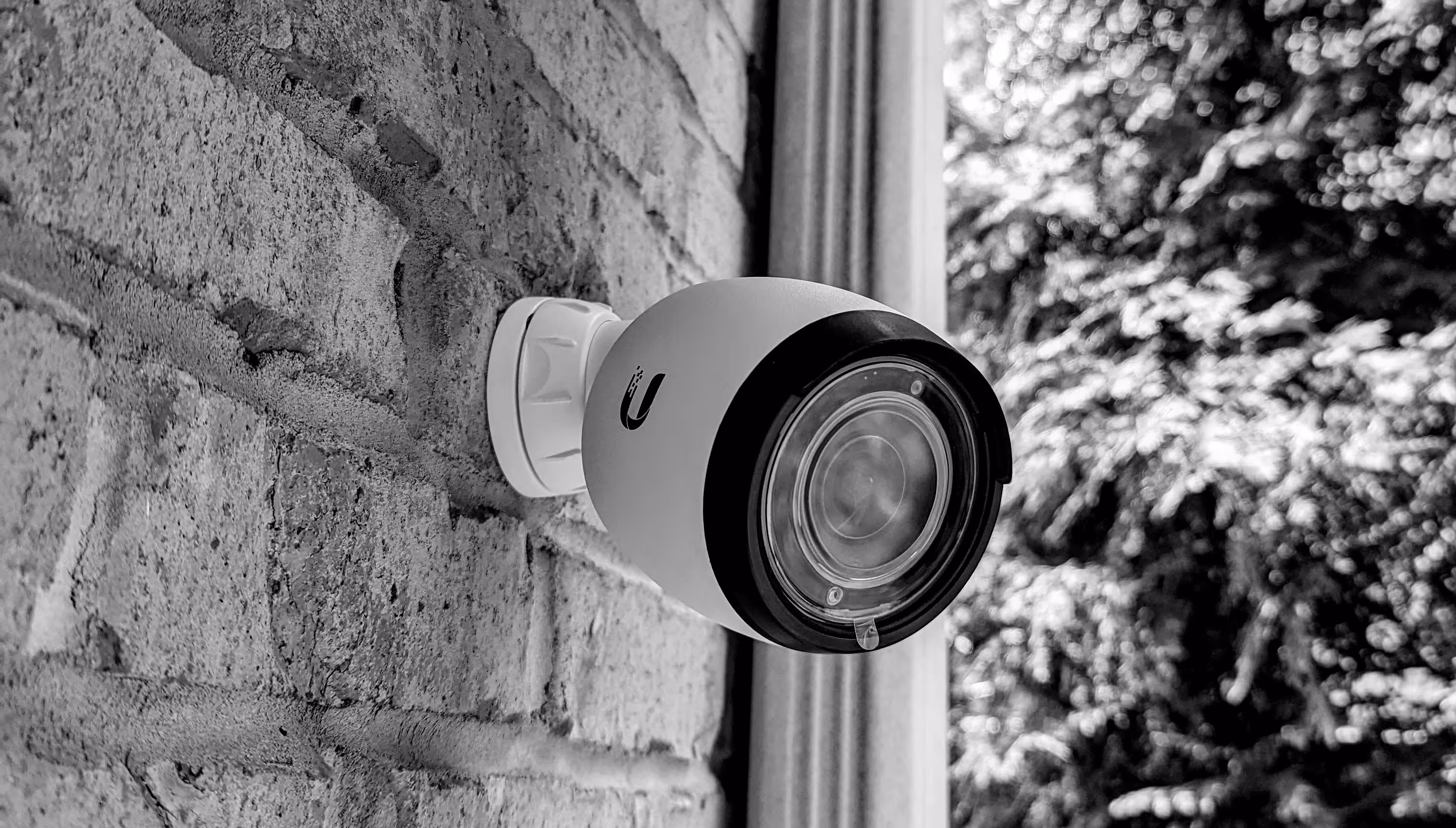 Exterior security camera professionally installed on a brick building in Pittsburgh