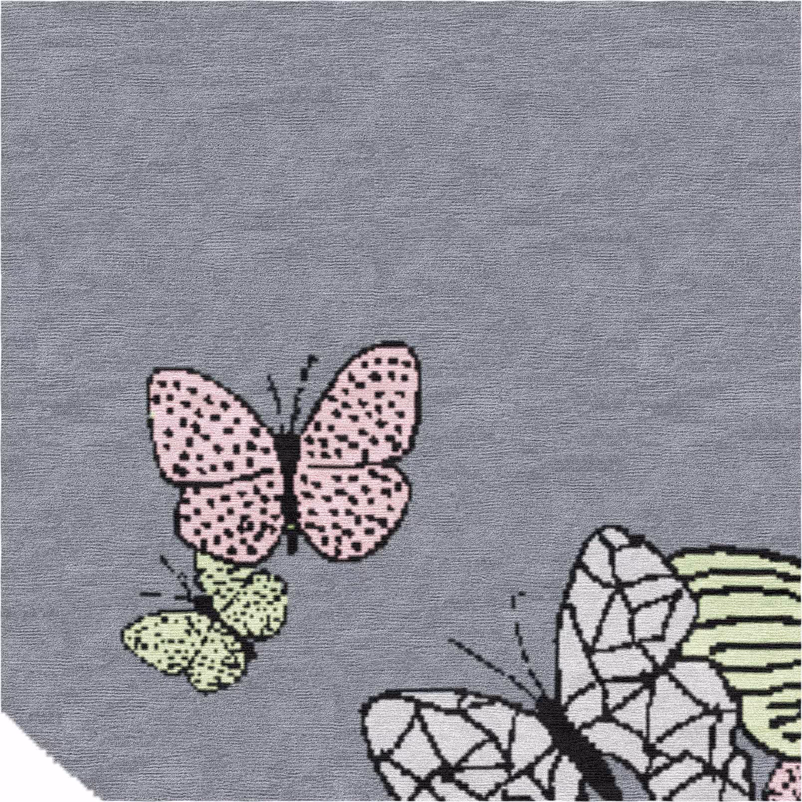 Close-up of pink and white butterfly detail on luxury hand-knotted rug, showcasing hand-drawn design and fine wool-silk craftsmanship.