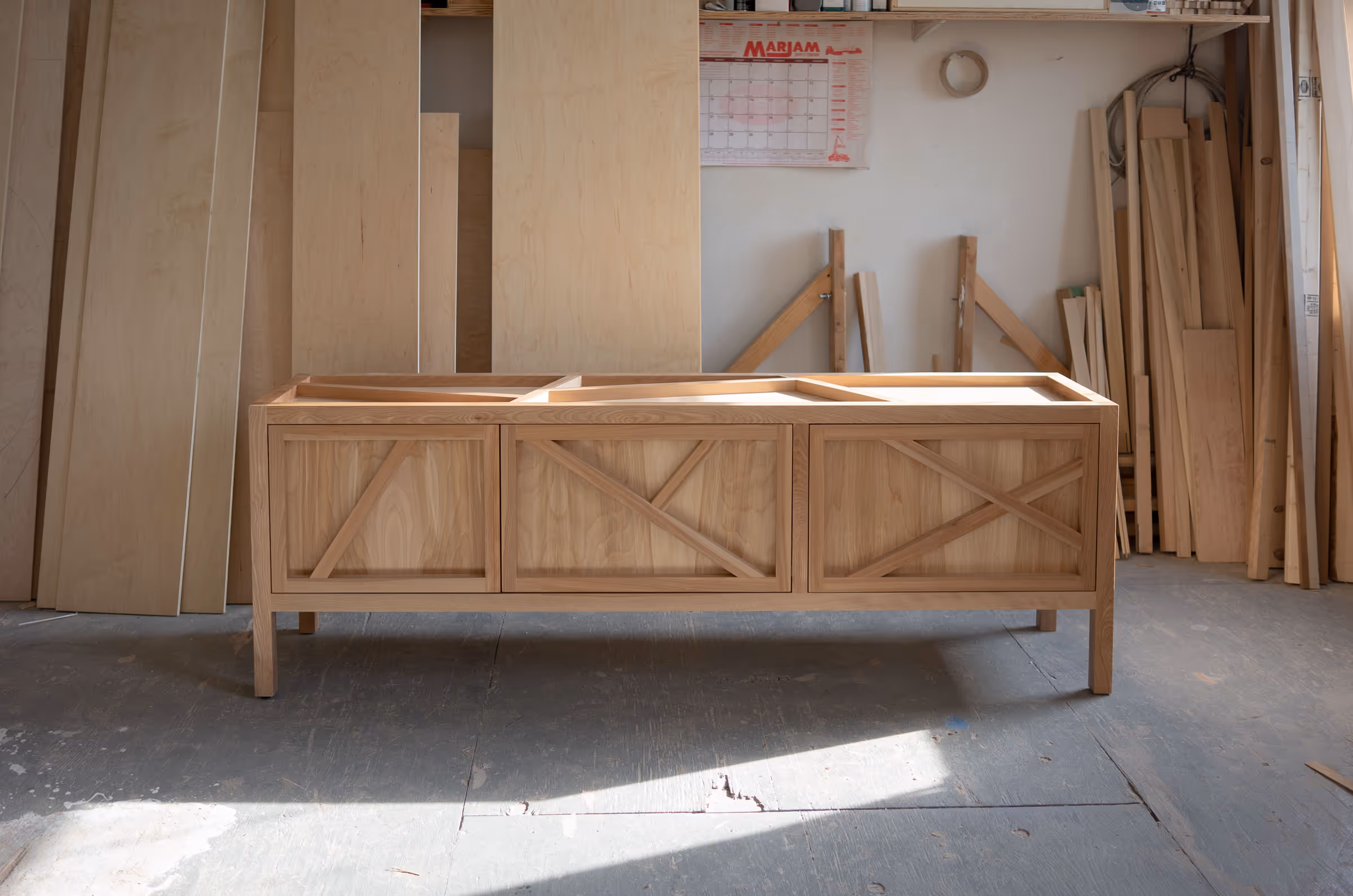 Wide Birch Credenza with pink lacquer interiors. Handmade