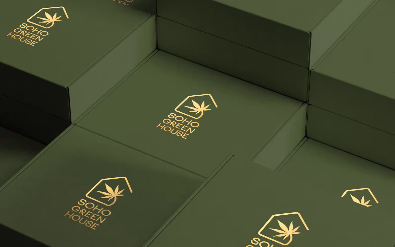 Soho Greenhouse Cannabis Dispensary Brand Identity. Stacked green boxes with gold leaf logo