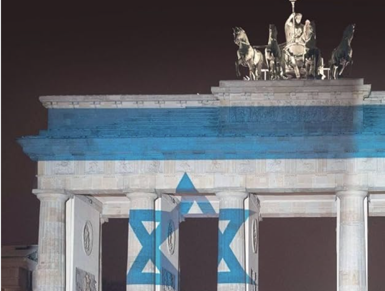 Cover of book with Brandenburg Gate with blue and white lights with Star of David
