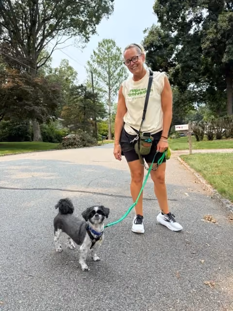 Dog Walker from Pups and Recreation walking a dog on School House Road in Randolph NJ.