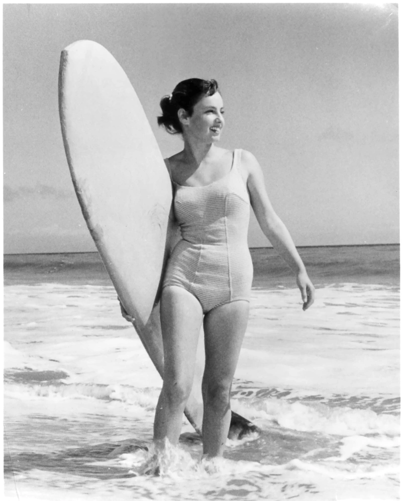 Gidget with a surfboard