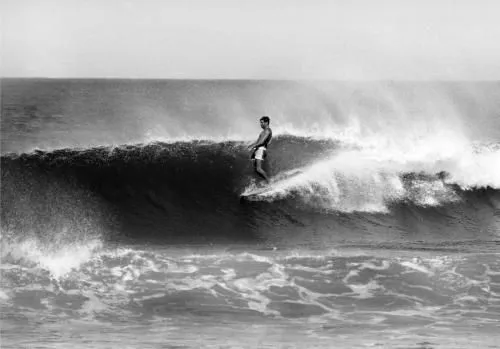 Miki Dora surfing a big wave