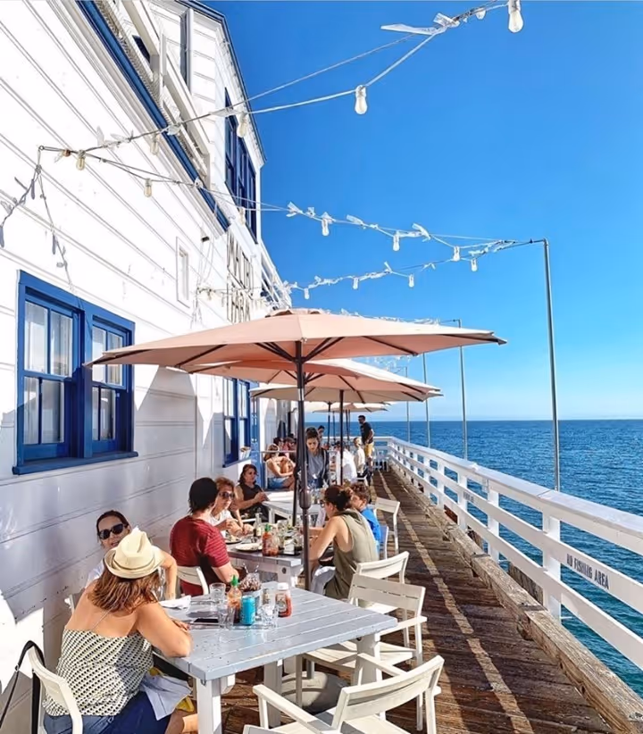 people eating at the pier