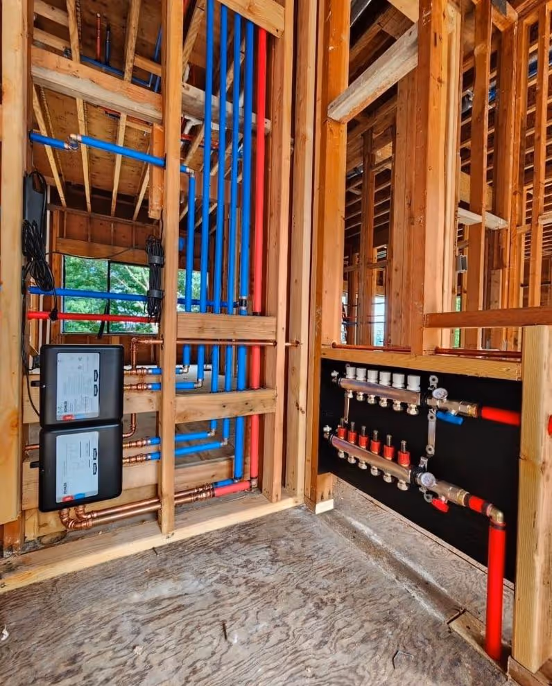 Manifold plumbing system installation in a framed new construction home.